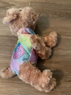 Poochie & co | Plush Teddy Dog with Pastel Rainbow Sequin Heart Outfit